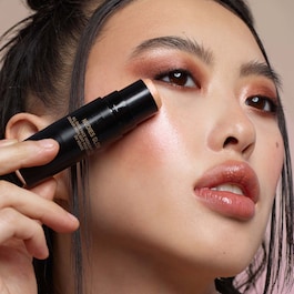 Nudies All Over Face Color Bronze + Glow - Sztyft brązujący i rozświetlający